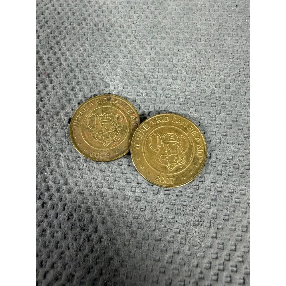 Chuck E. Cheese Game Tokens Lot of 2 Vintage 2004 2007 Collectible Arcade Coins